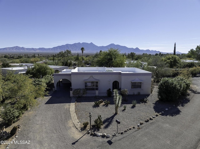 view of front of home featuring a carport and a mountain view