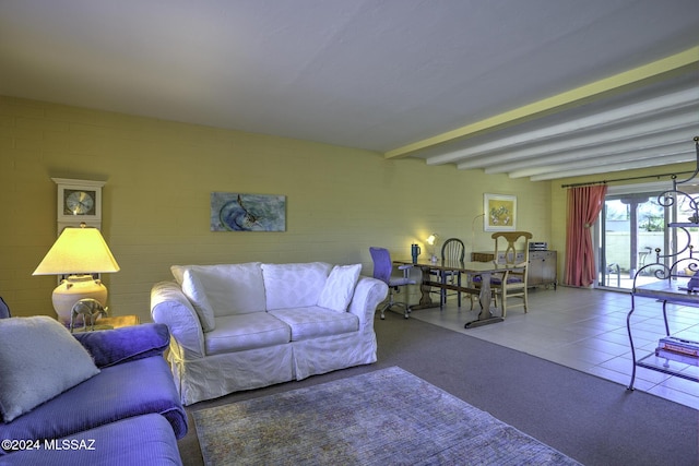 tiled living room featuring beam ceiling