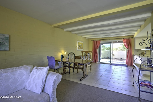 tiled living room with beamed ceiling