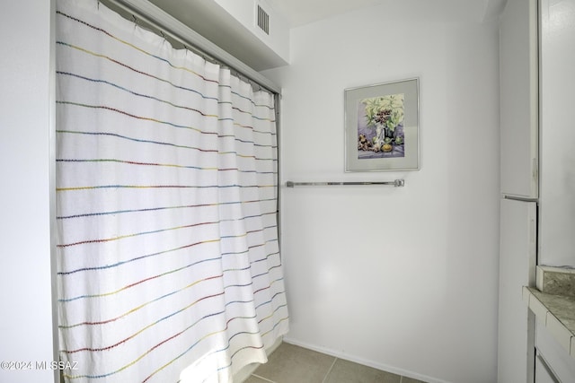 bathroom with tile patterned flooring