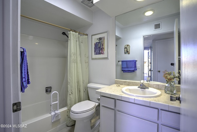 full bathroom featuring vanity, toilet, and shower / tub combo with curtain