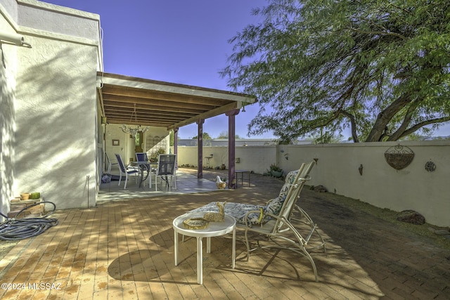 view of patio terrace at dusk