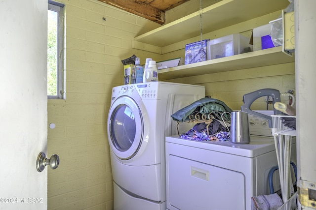 laundry area featuring washing machine and clothes dryer