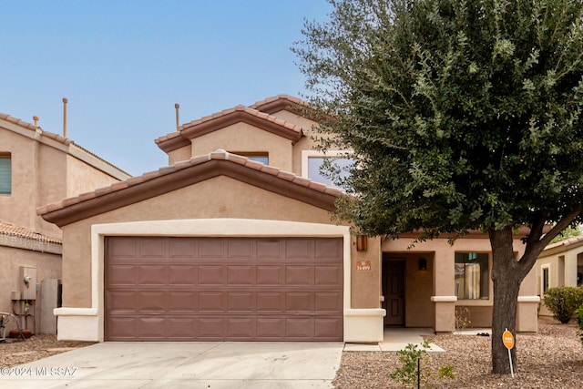 mediterranean / spanish-style home featuring a garage