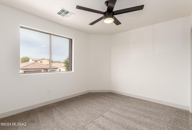 unfurnished room featuring carpet and ceiling fan