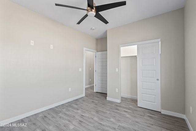 unfurnished bedroom with light wood-type flooring, a closet, and ceiling fan