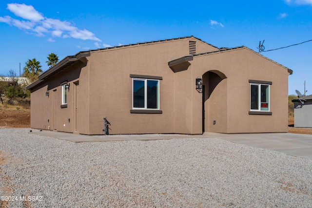 back of property featuring a patio