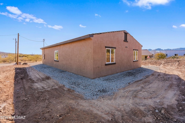 view of side of property featuring a mountain view