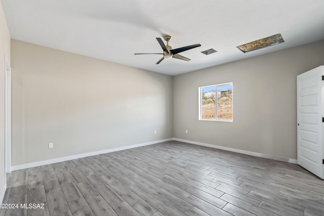 unfurnished bedroom with ceiling fan and light hardwood / wood-style flooring