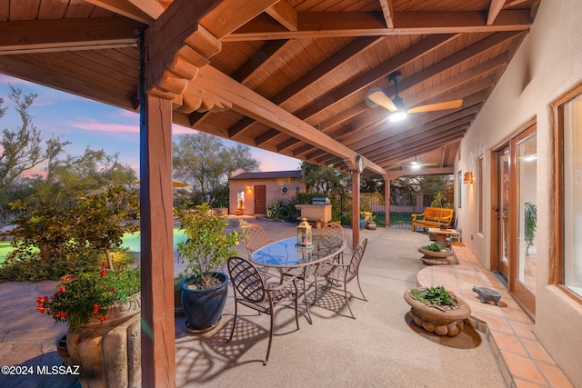 view of patio terrace at dusk