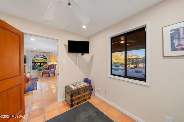 hallway featuring light tile patterned floors