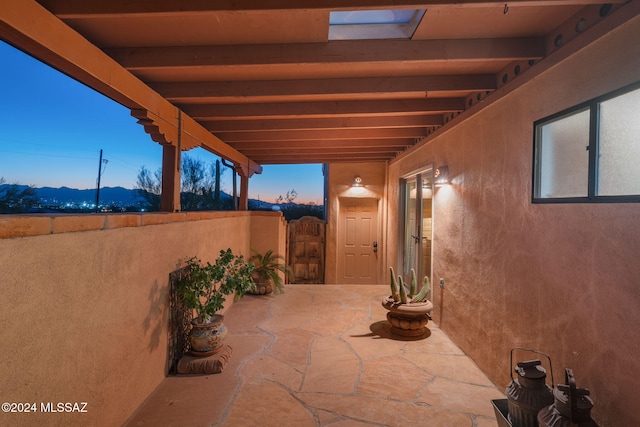 view of patio terrace at dusk