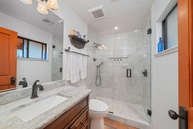 bathroom with walk in shower, tile patterned flooring, vanity, and toilet