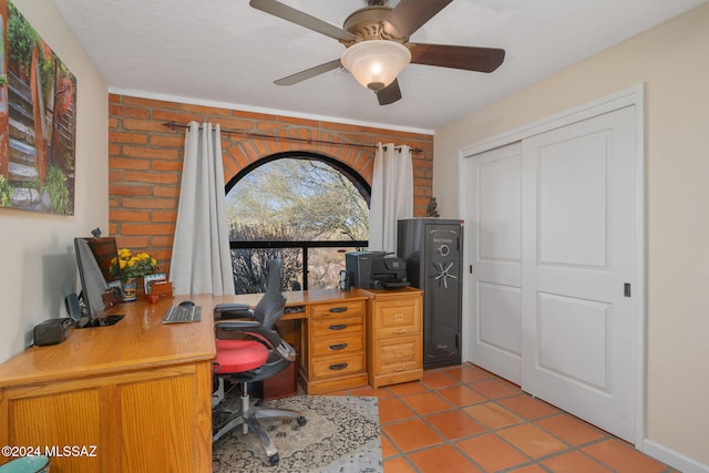 home office with ceiling fan and light tile patterned floors