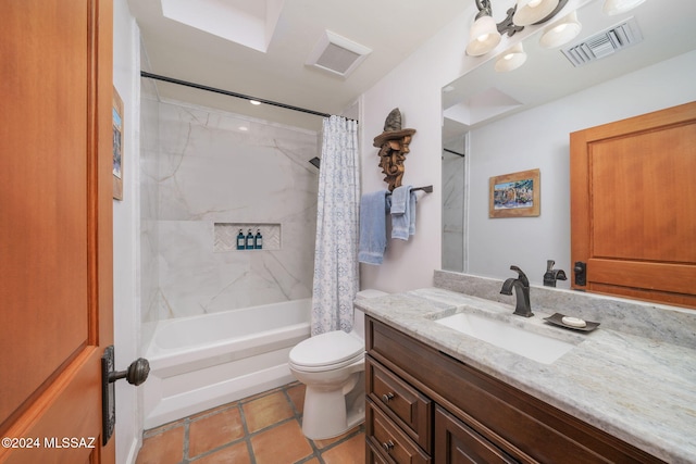 full bathroom featuring shower / bath combo, vanity, toilet, and tile patterned floors