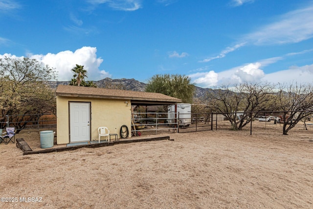 view of outbuilding with a mountain view