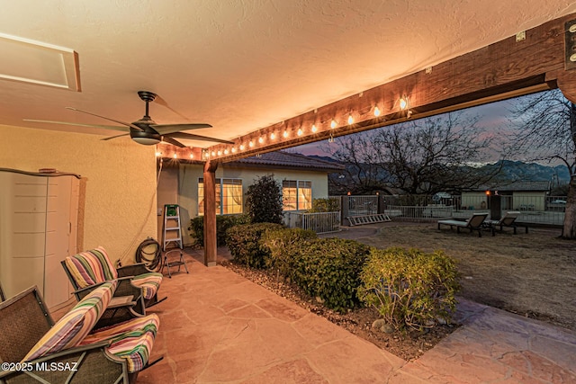 patio terrace at dusk with ceiling fan