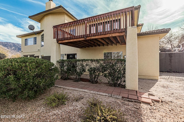 back of house featuring a deck