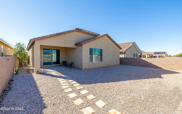 back of property featuring a patio