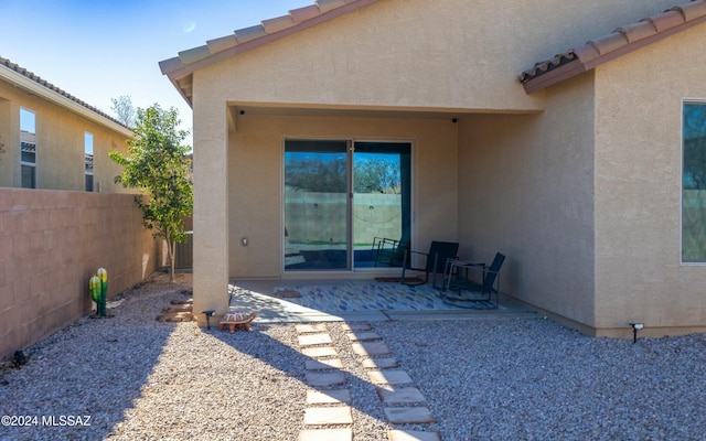 rear view of house featuring a patio