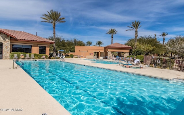 view of pool featuring a patio