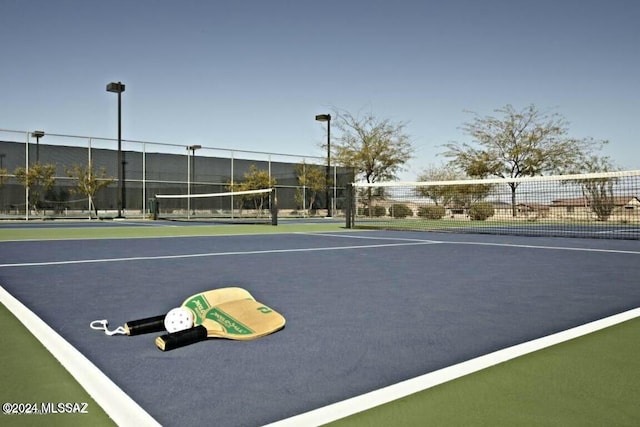 view of sport court featuring basketball hoop