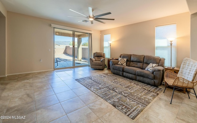 tiled living room featuring ceiling fan