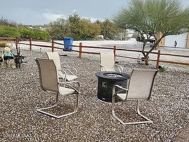 view of patio with a fire pit and central air condition unit