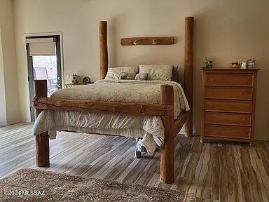 bedroom featuring dark wood-type flooring