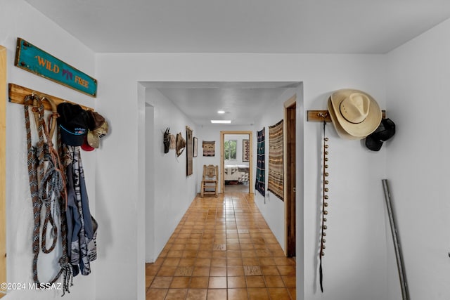 hall with tile patterned flooring