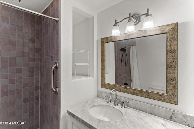 bathroom with vanity and a shower with shower curtain