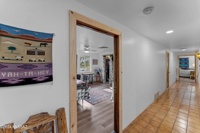 hall with light wood-type flooring