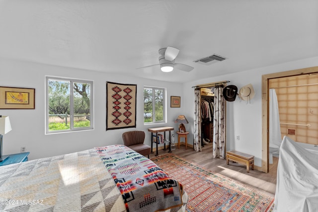 bedroom with ceiling fan, a closet, and light wood-type flooring