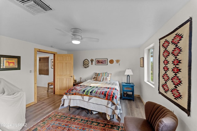 bedroom featuring light hardwood / wood-style flooring and ceiling fan