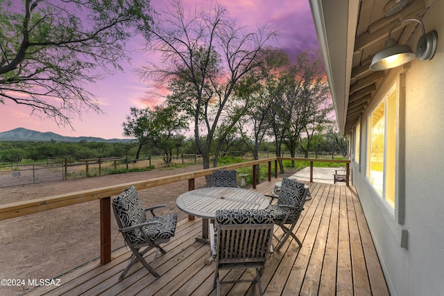 deck at dusk with a mountain view