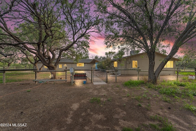 view of yard at dusk