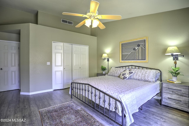 bedroom featuring dark hardwood / wood-style flooring, a closet, and ceiling fan