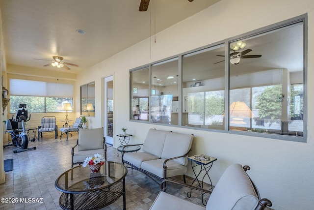 sunroom / solarium with ceiling fan