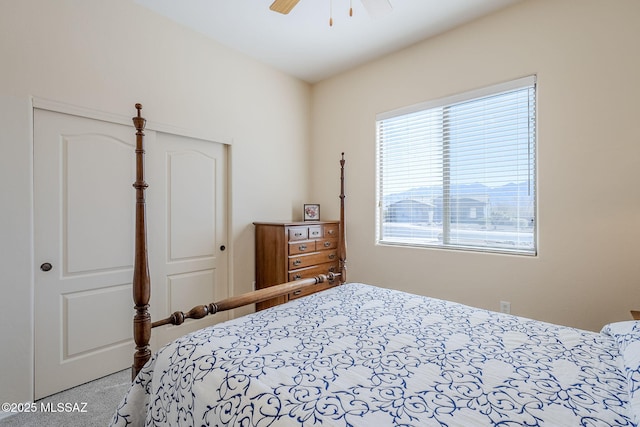 bedroom featuring ceiling fan and light colored carpet