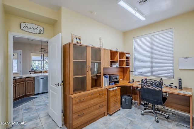 home office featuring light tile patterned flooring