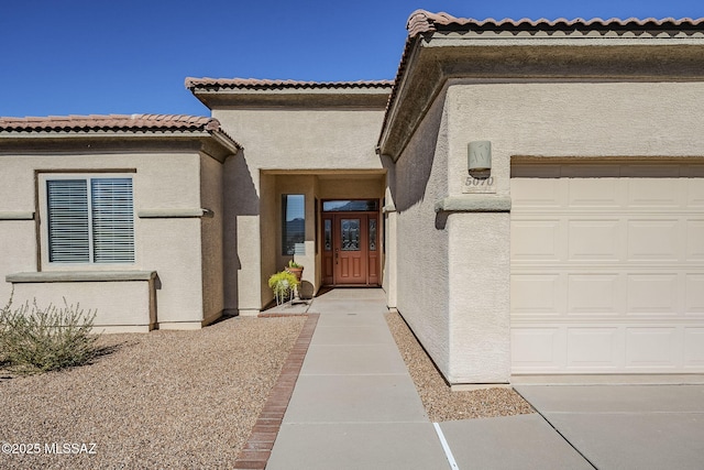 doorway to property featuring a garage