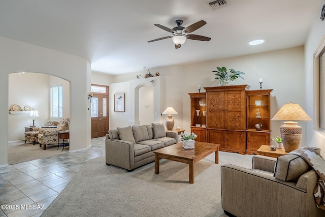 living room with light tile patterned floors and ceiling fan