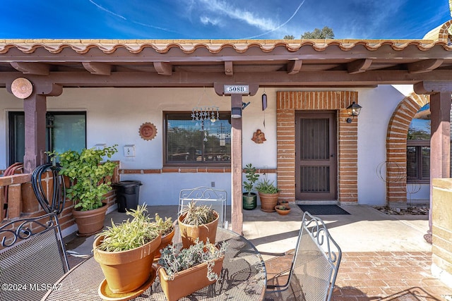 property entrance with a patio