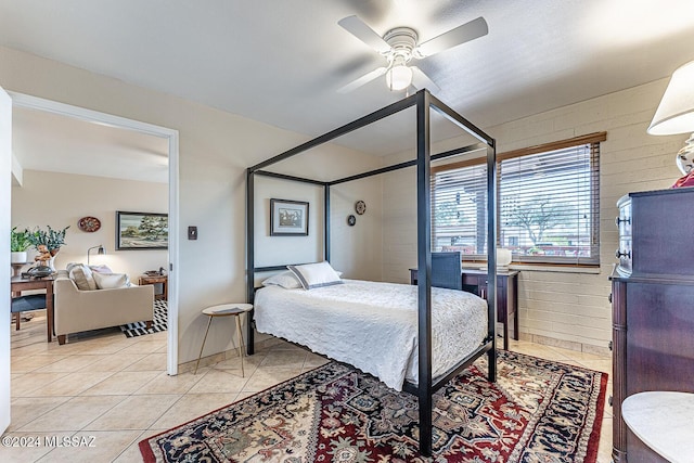 bedroom with ceiling fan and light tile patterned floors