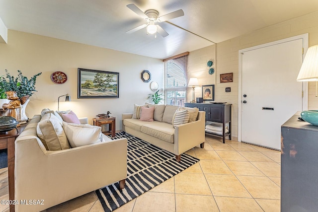 living room with ceiling fan and light tile patterned flooring