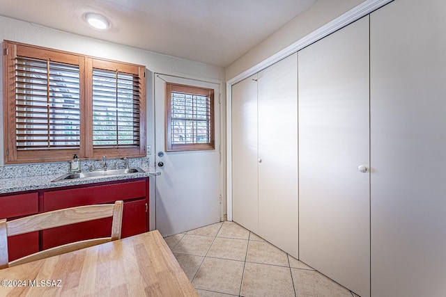 interior space featuring tile patterned flooring and sink