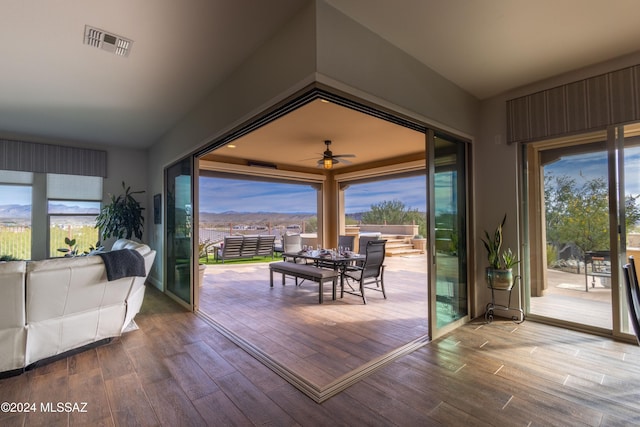 doorway to outside featuring hardwood / wood-style flooring, plenty of natural light, and ceiling fan