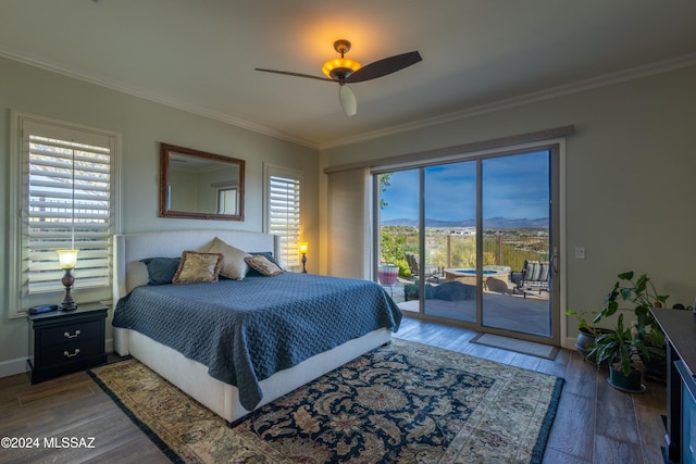 bedroom with hardwood / wood-style floors, ceiling fan, access to outside, and multiple windows