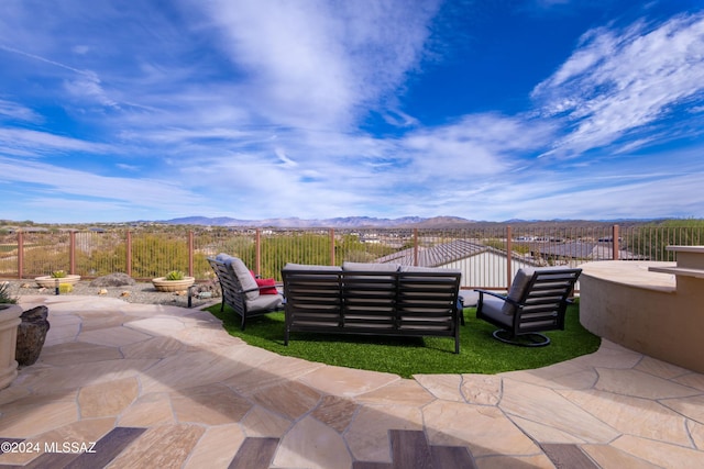 view of patio / terrace featuring outdoor lounge area and a mountain view