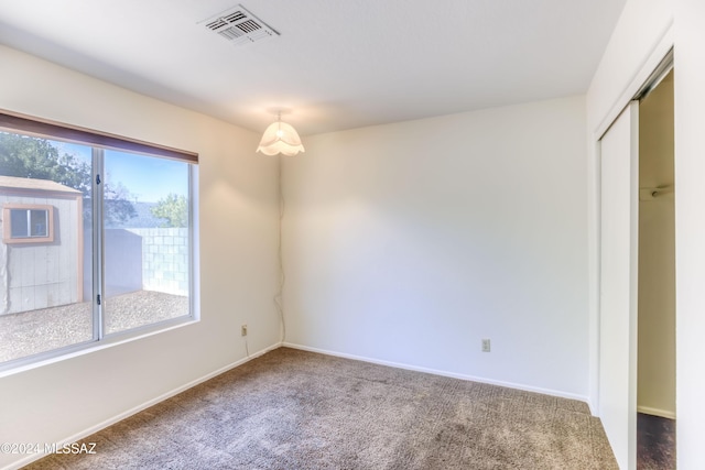 view of carpeted spare room